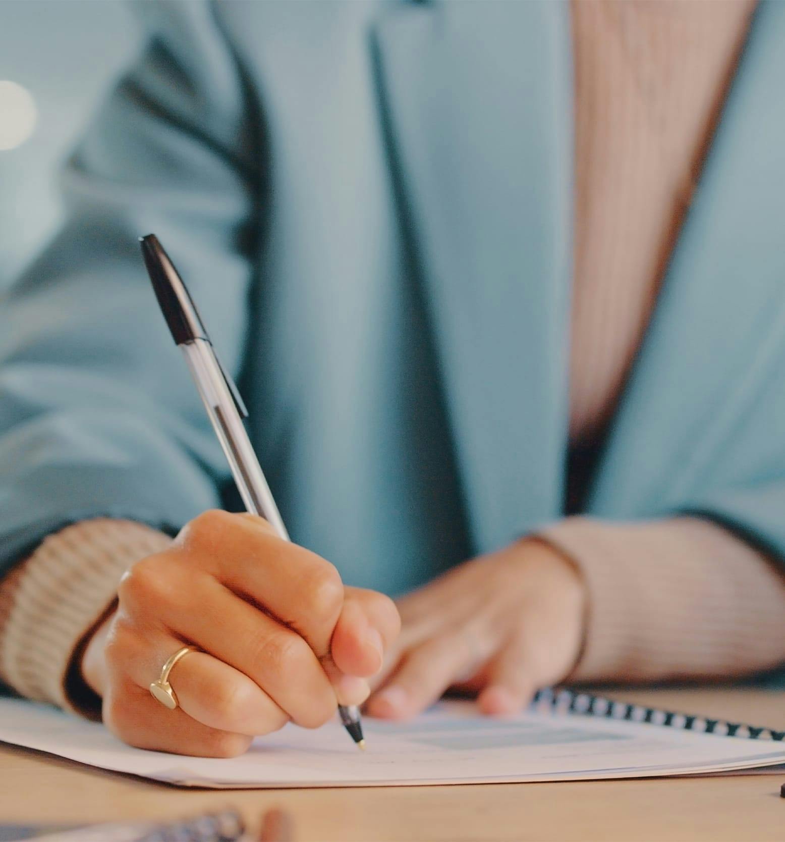 woman writing out form