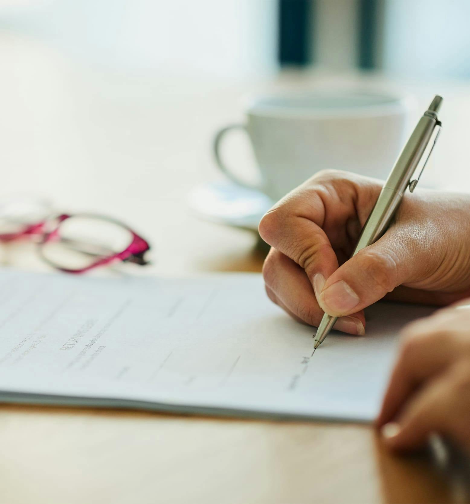 person writing the signature