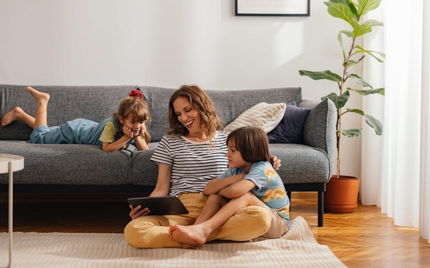 mom on floor with her 2 kids
