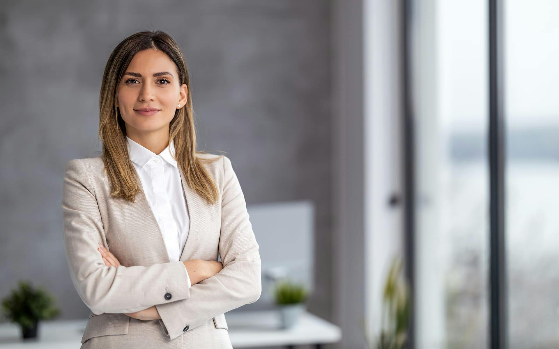 woman crossing her arms in suit