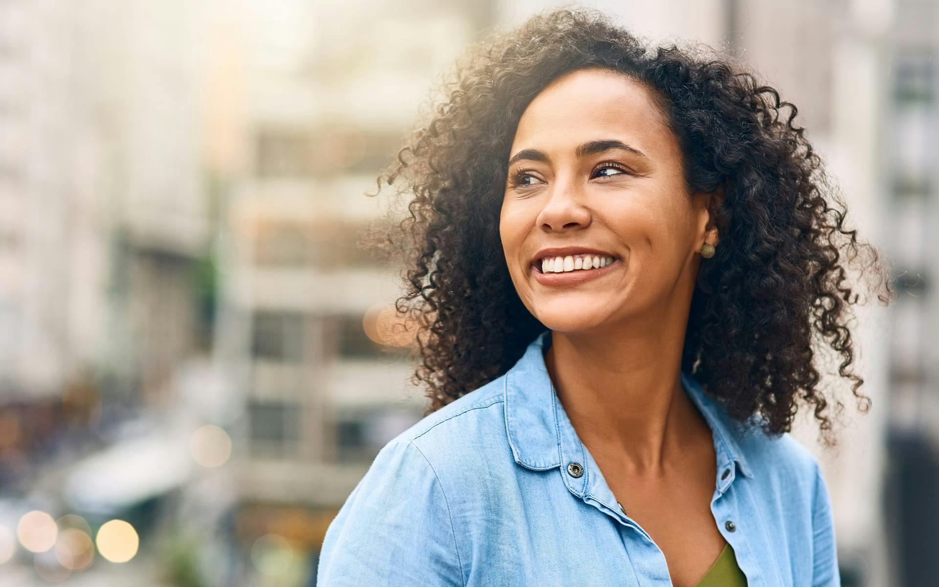 woman smiling looking to the left