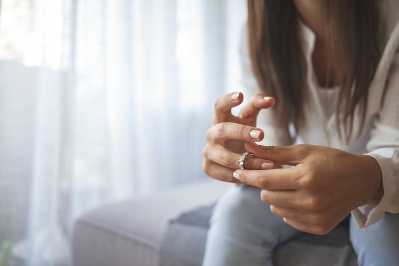 A woman touching her ring
