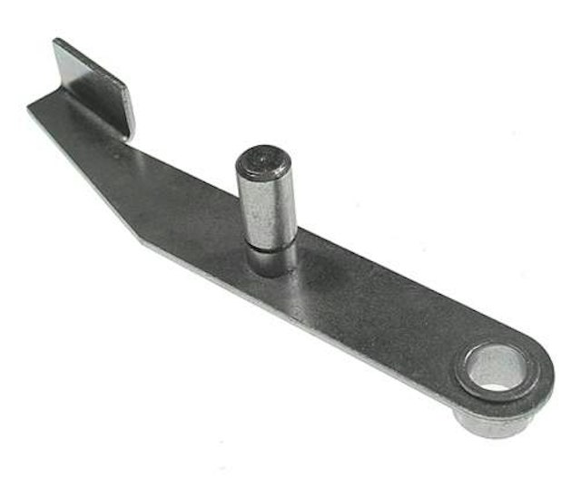 Kicker arm assembly