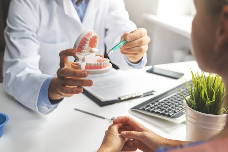 A dentist explaining during consultation