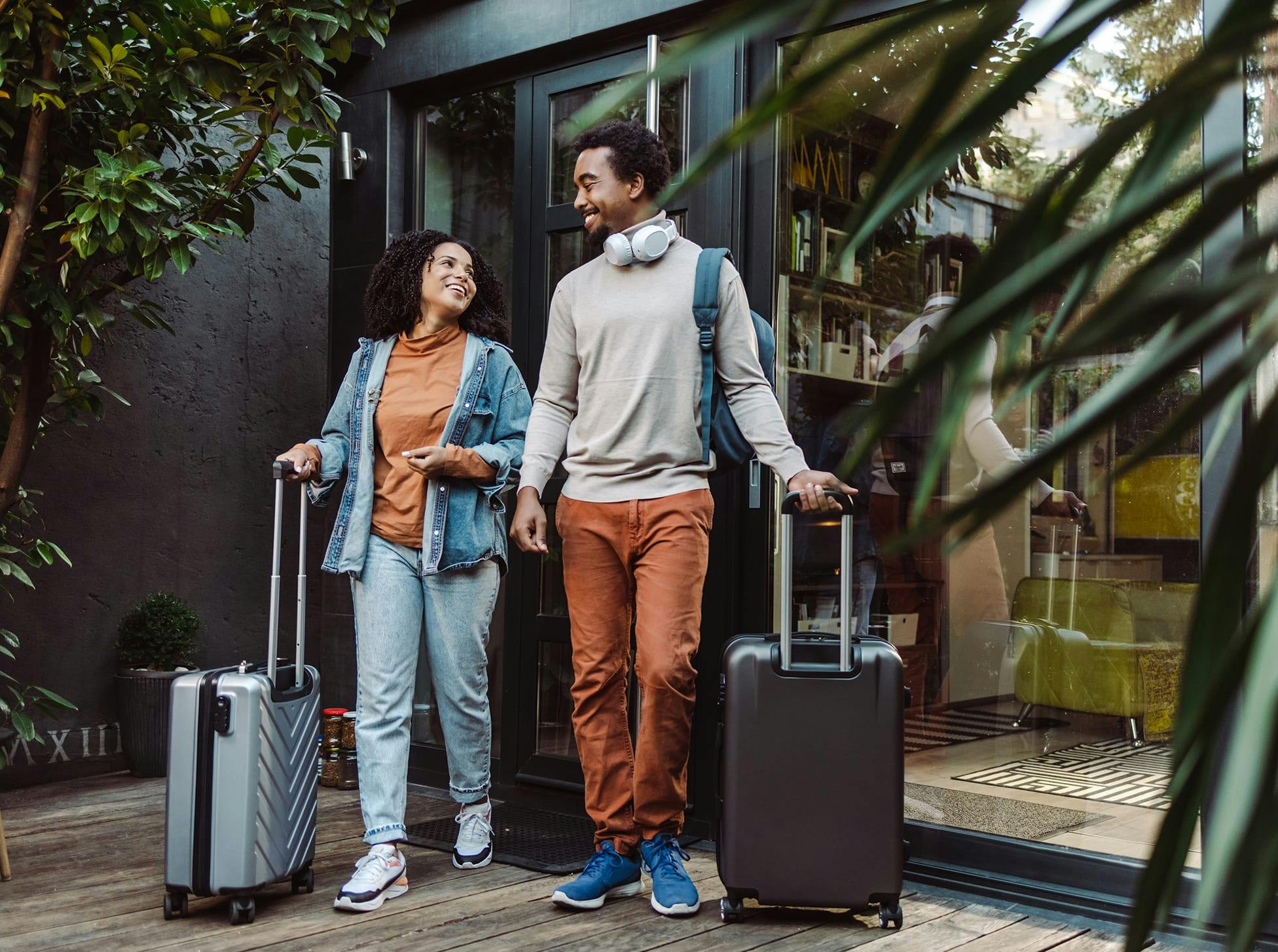 wan and woman walking with luggage