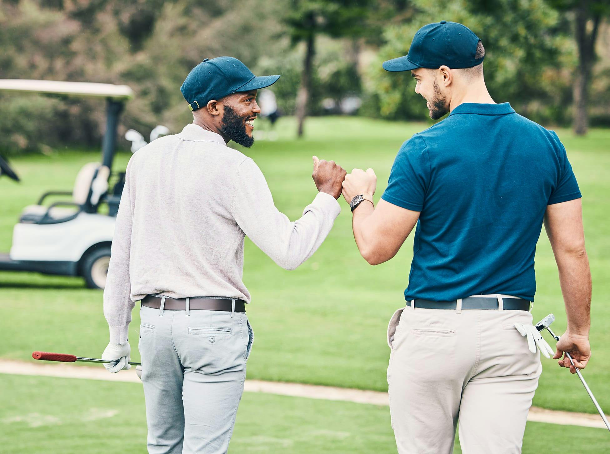 two men giving each other a fist bump