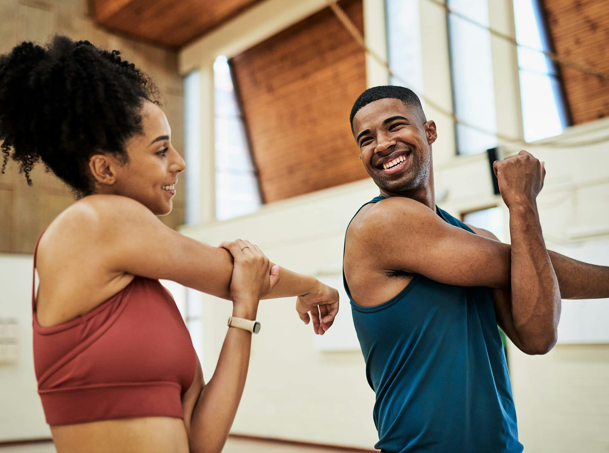 man and woman stretching