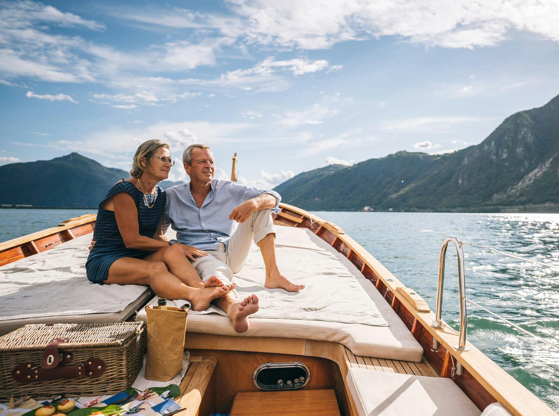 older man and woman sitting on a boat