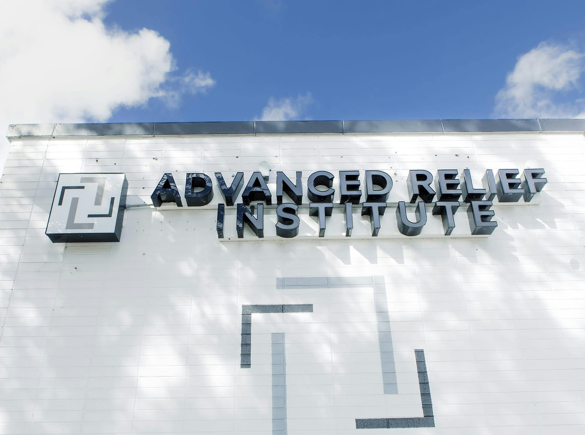 Advanced Relief Institute logo on a door