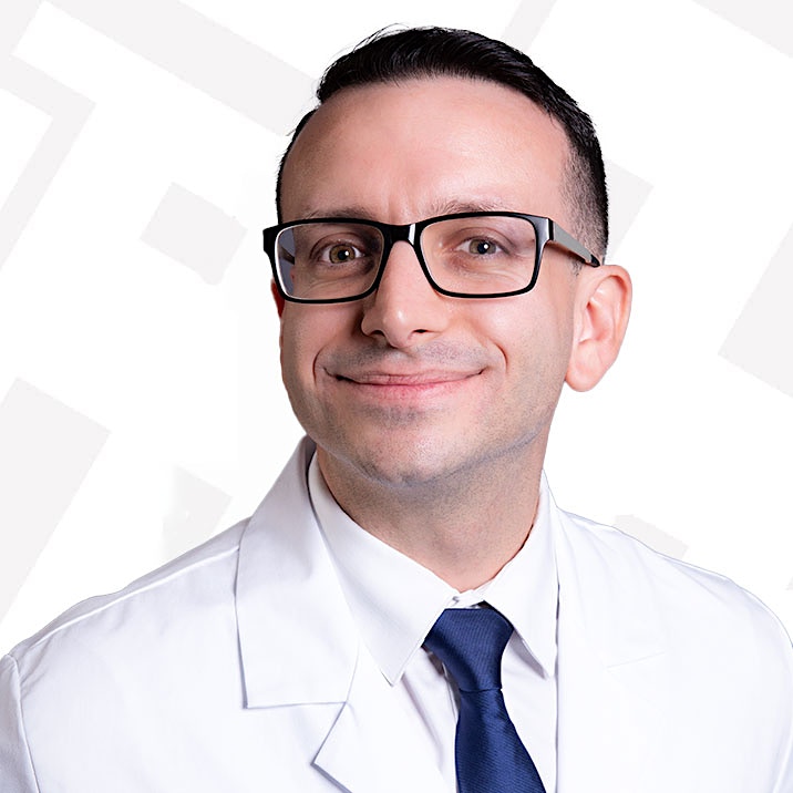 man in white lab coat aiello