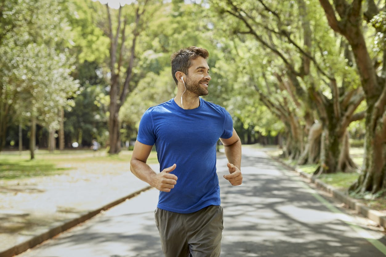 man in blue shirt running