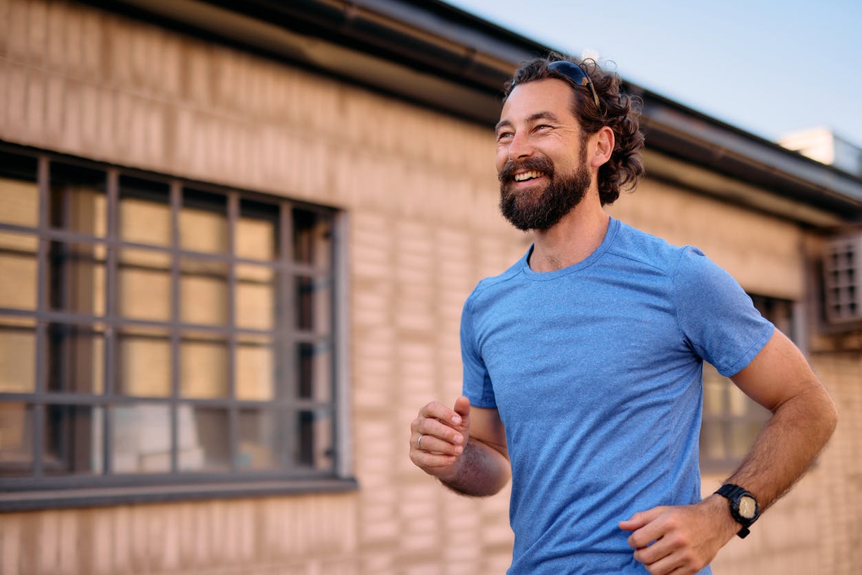 man smiling on a jog