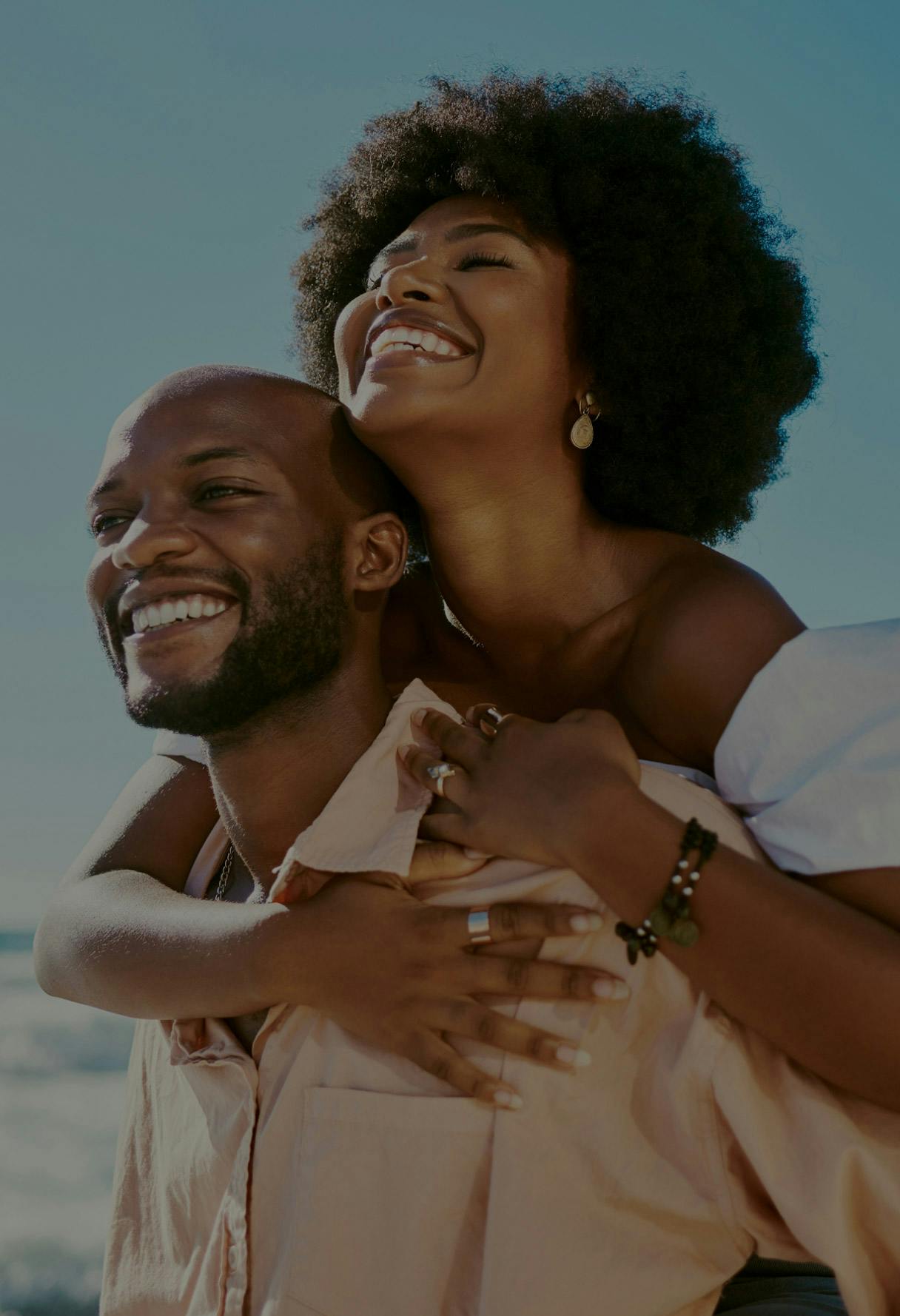man and woman smiling