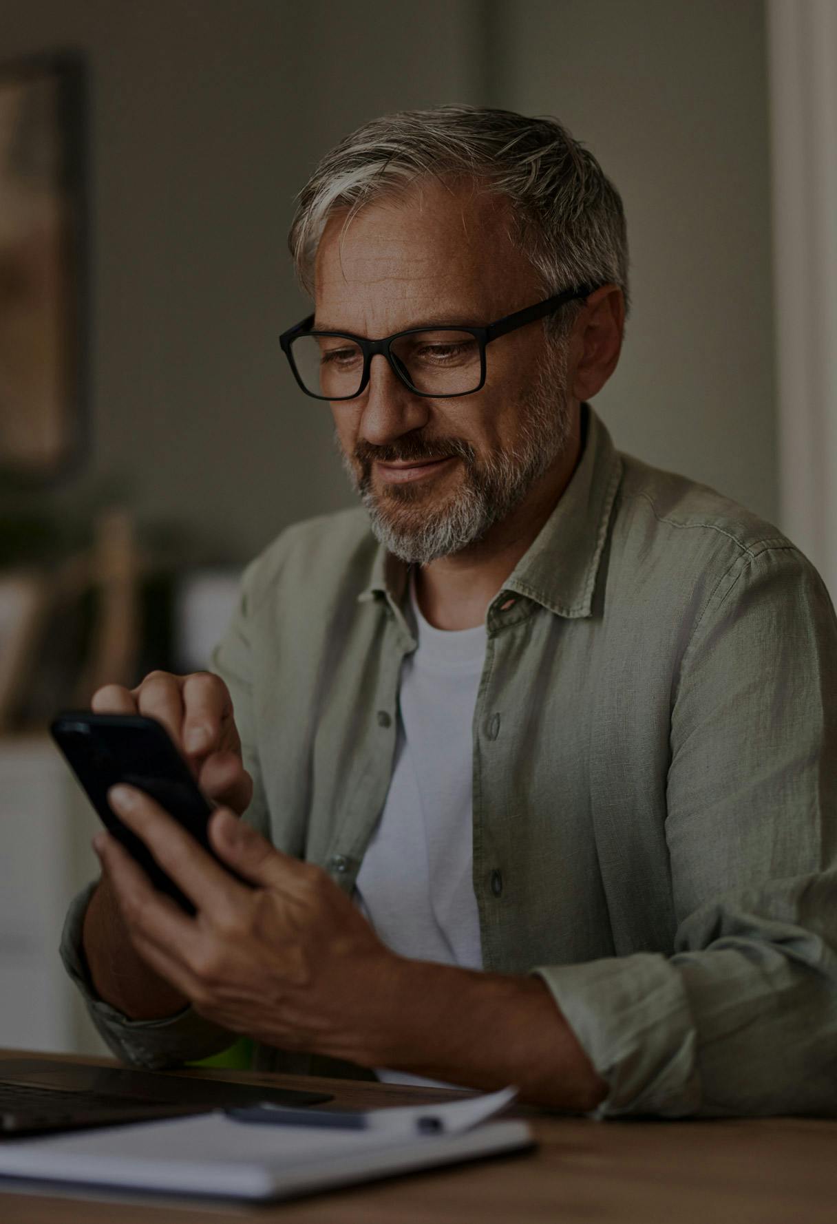 older man on a cell phone