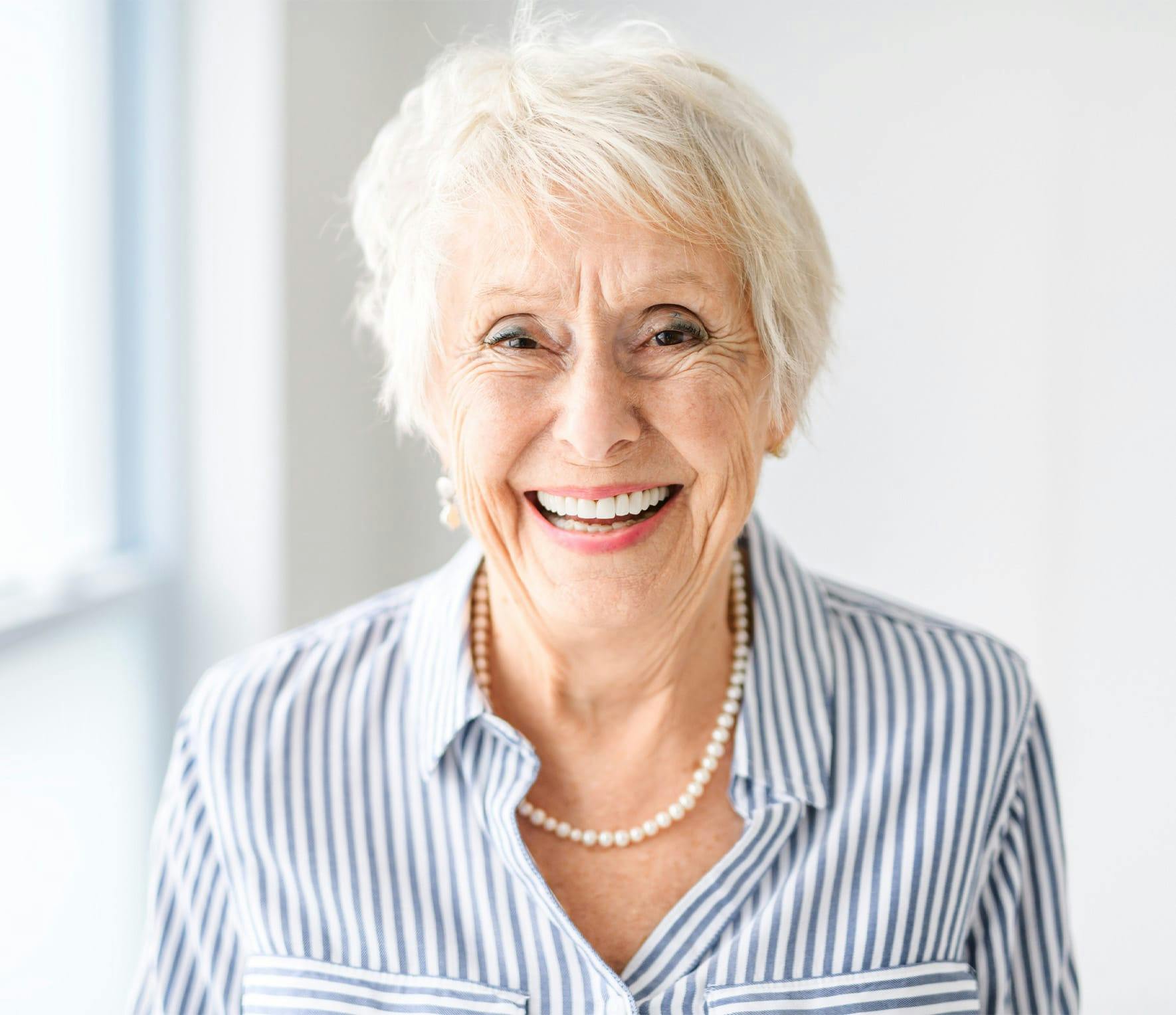 Woman smiling while sitting in chair