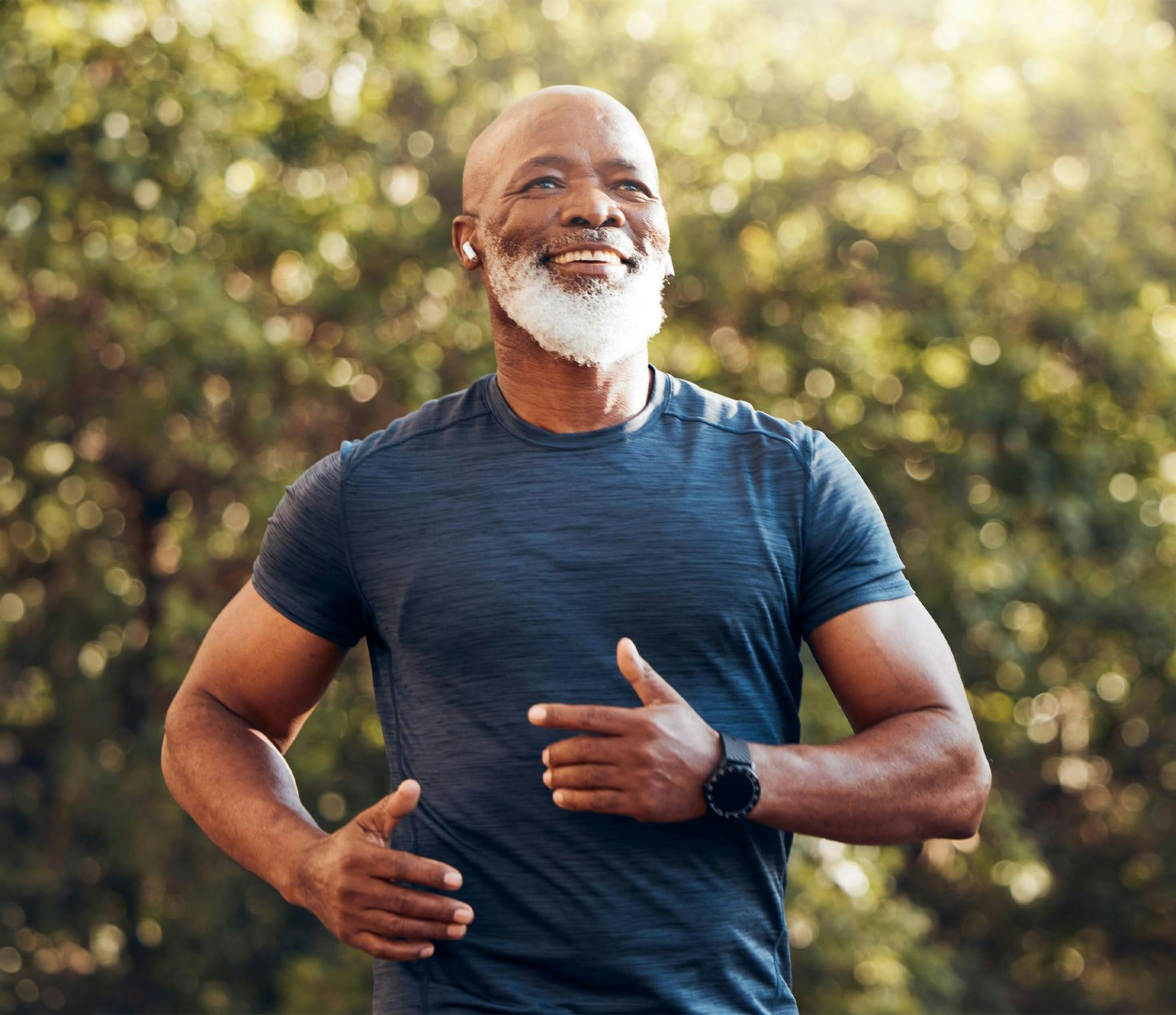 Bearded man in whit eshirt smiling