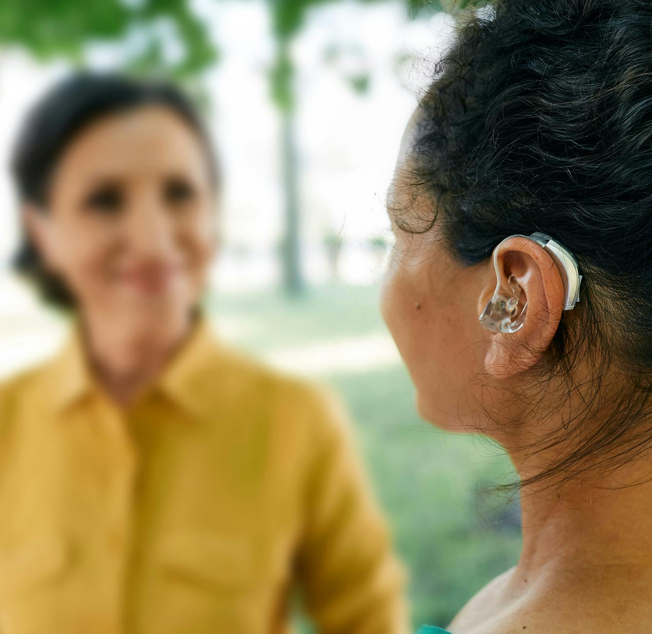 close up of woman with hearing aid