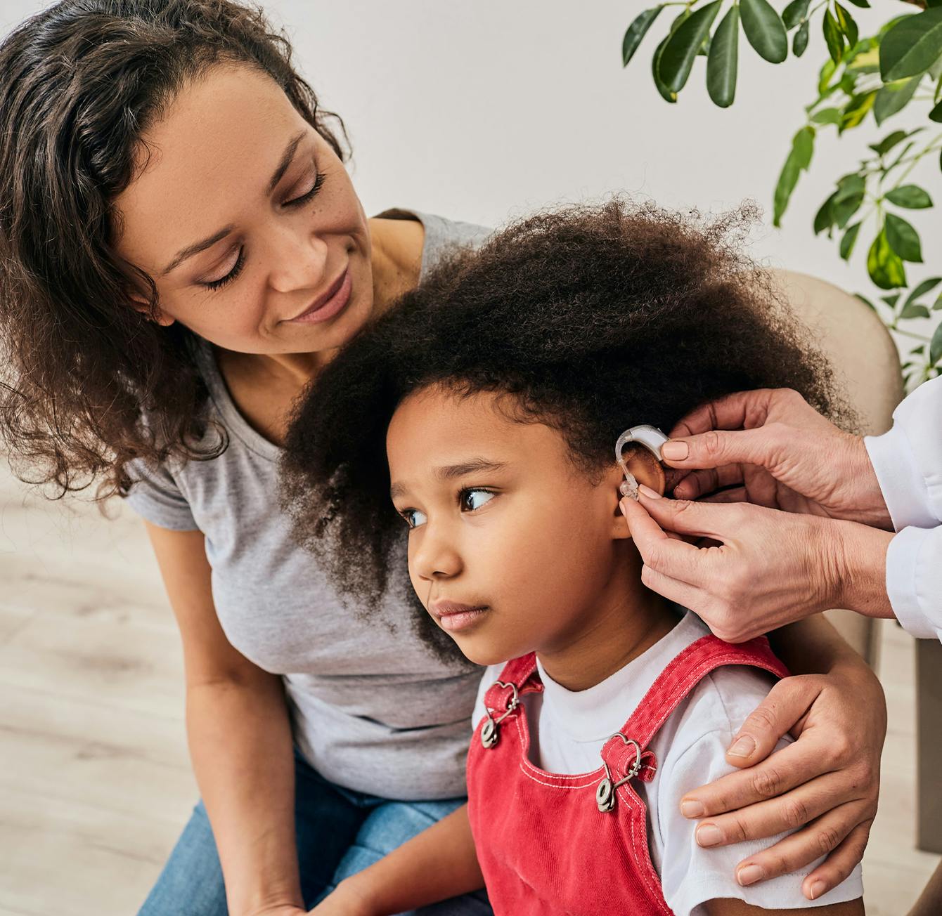 child receiving hearing aid