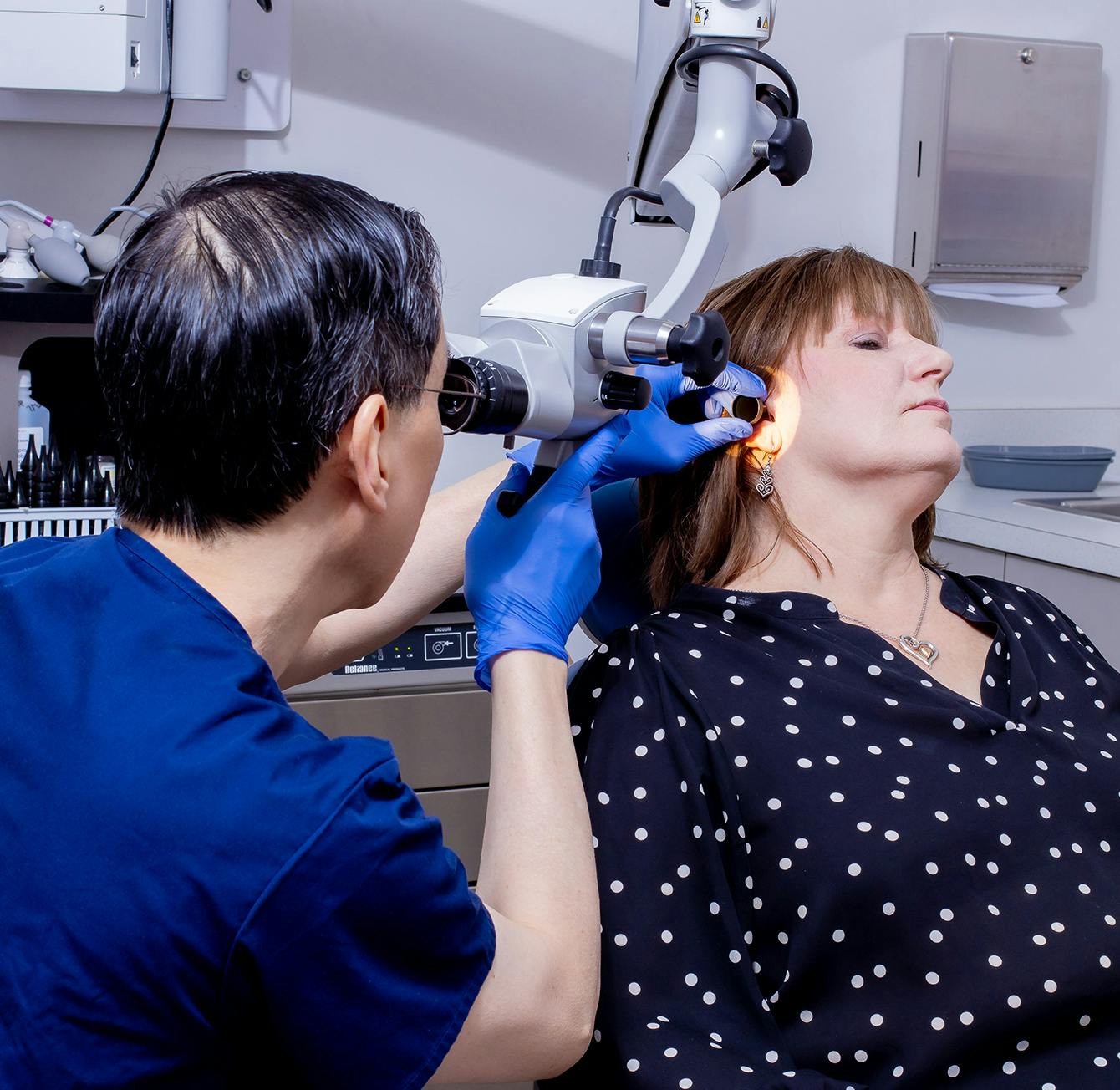 doctor diagnosing ear
