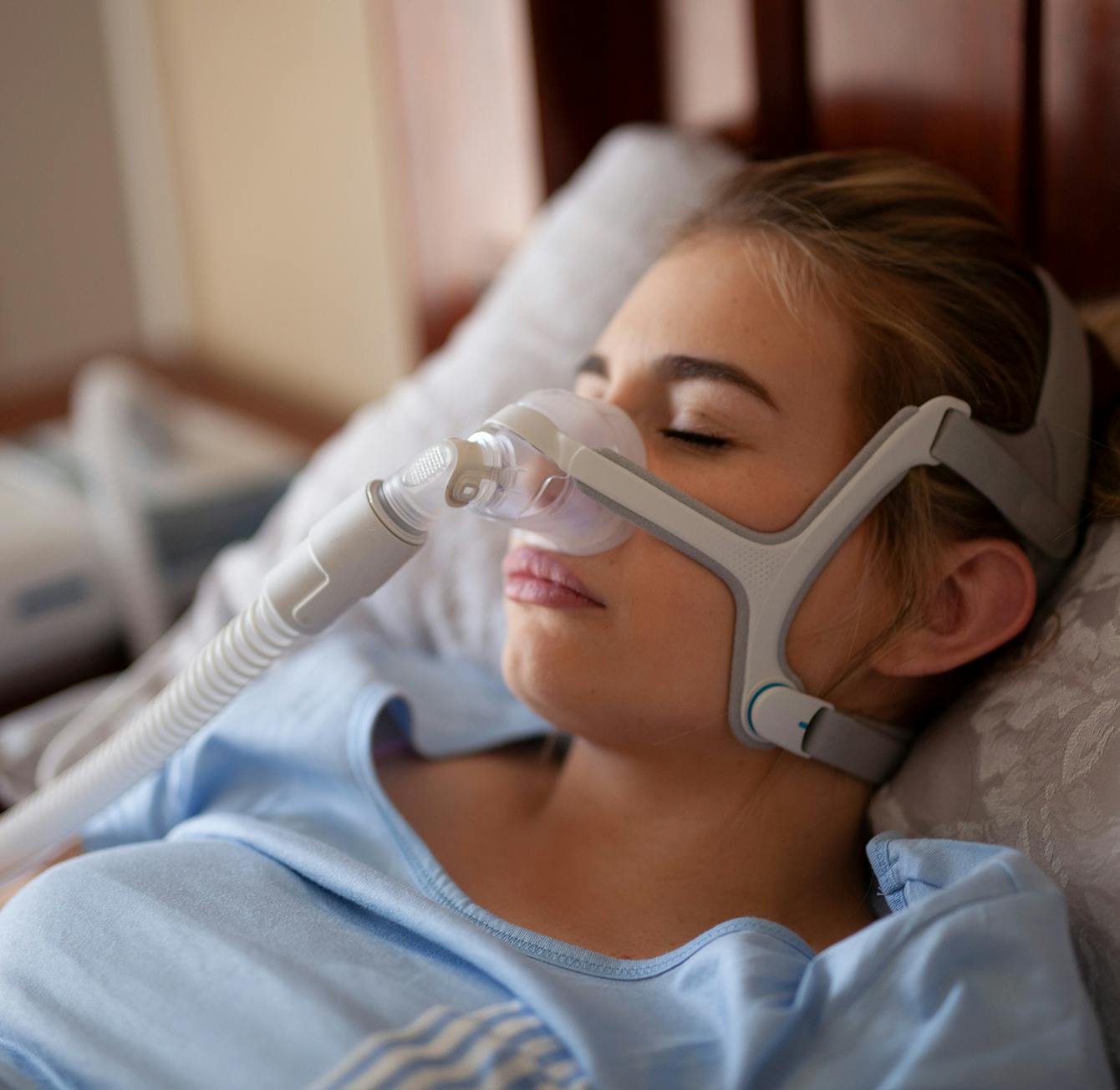 woman using a sleep apnea device