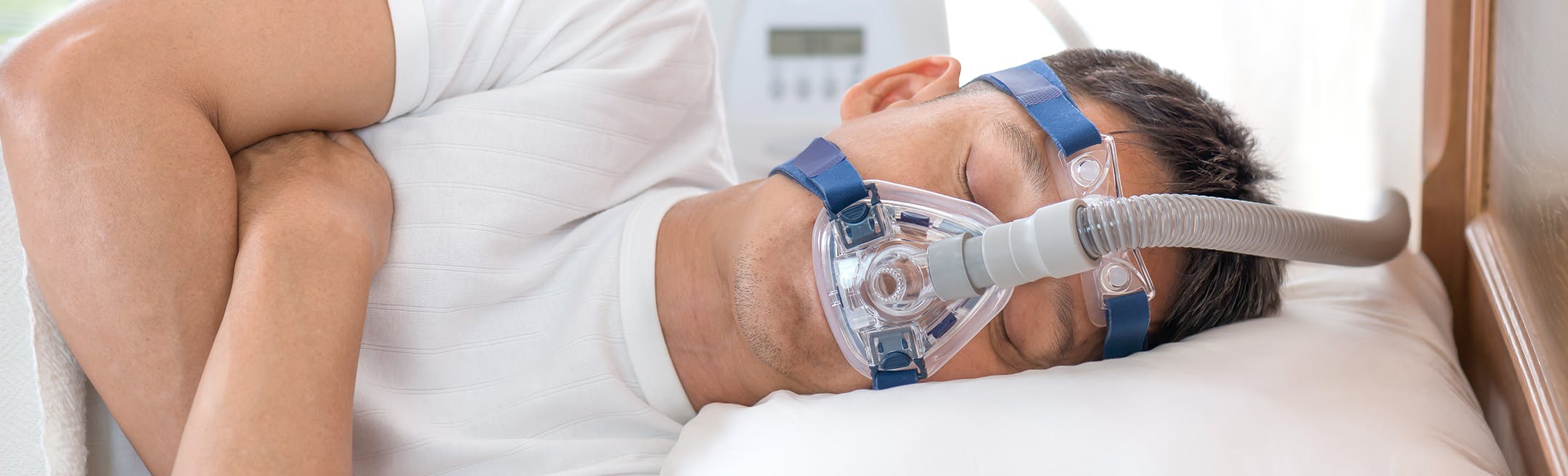 man using a sleep apnea device