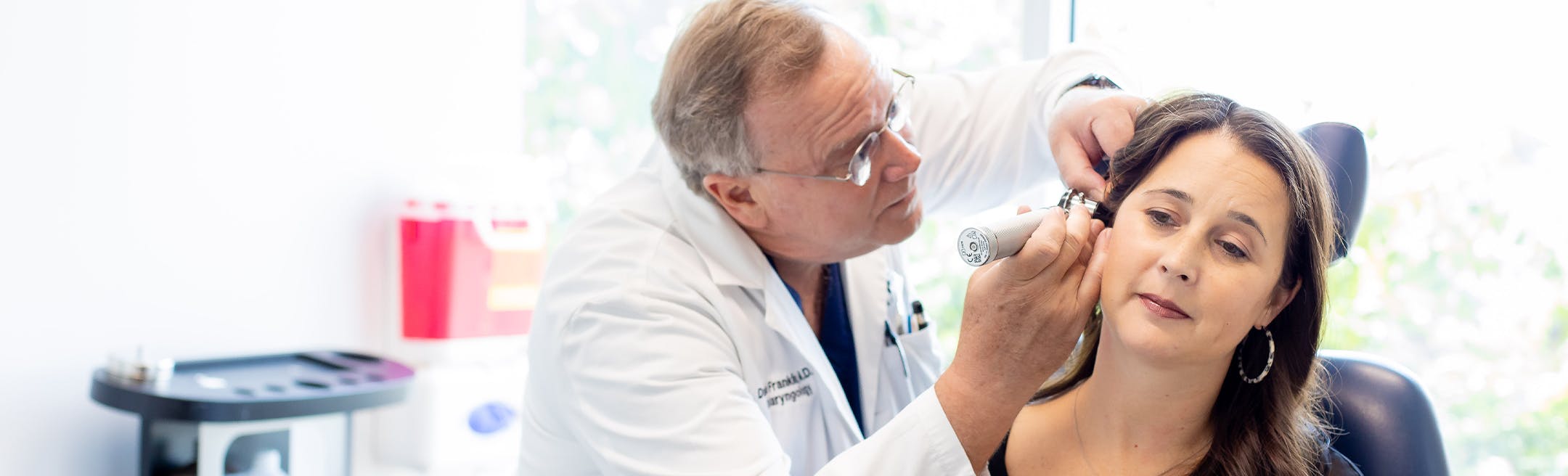 woman undergoing an ear exam