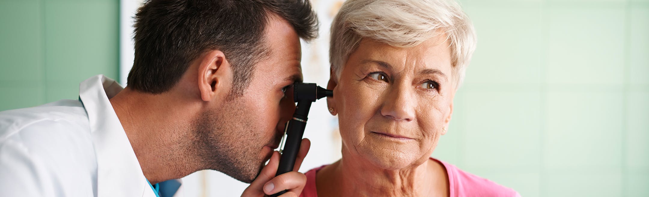 doctor looking in ear