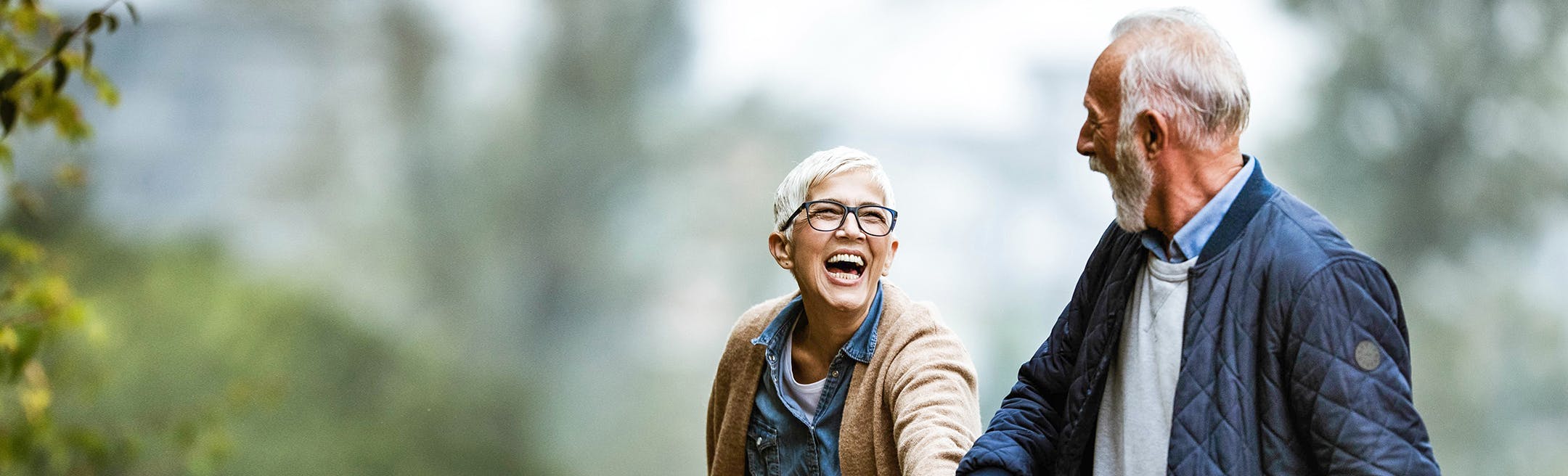 Man and woman holding hands while walking