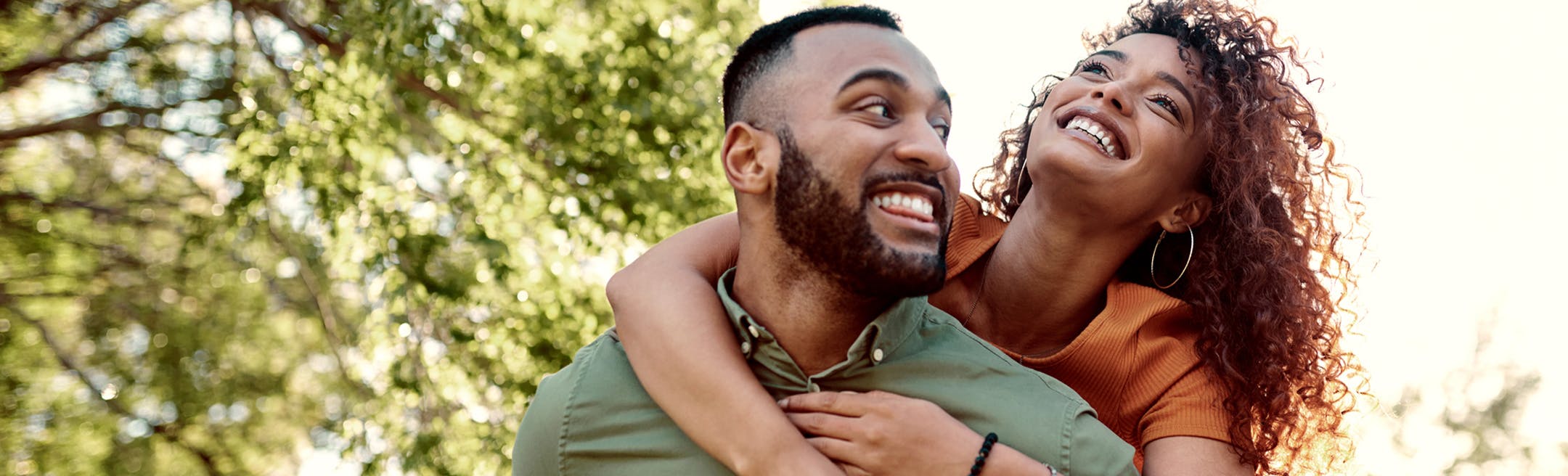 Woman hugging a man from behind