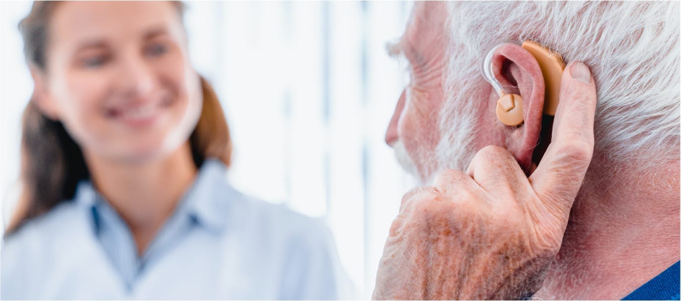 Male patient with hearing aid