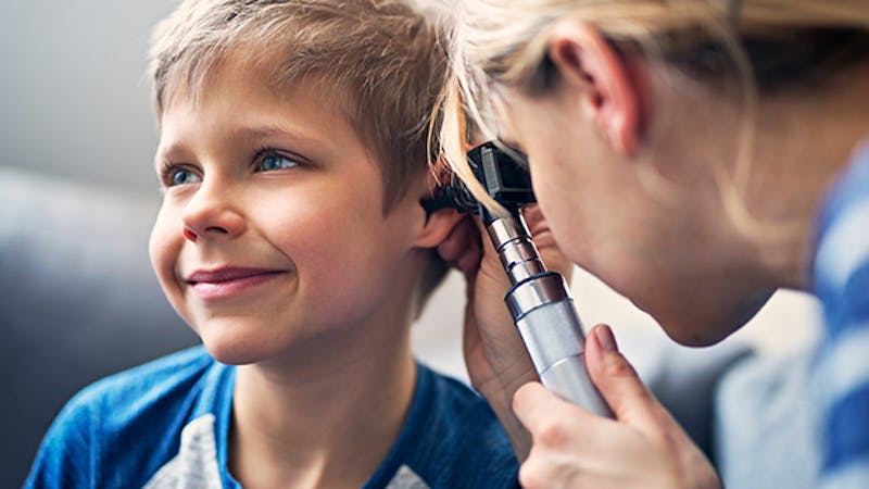 Boy getting his ears checked