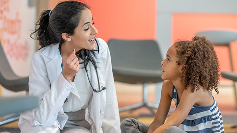 Doctor speaking with girl