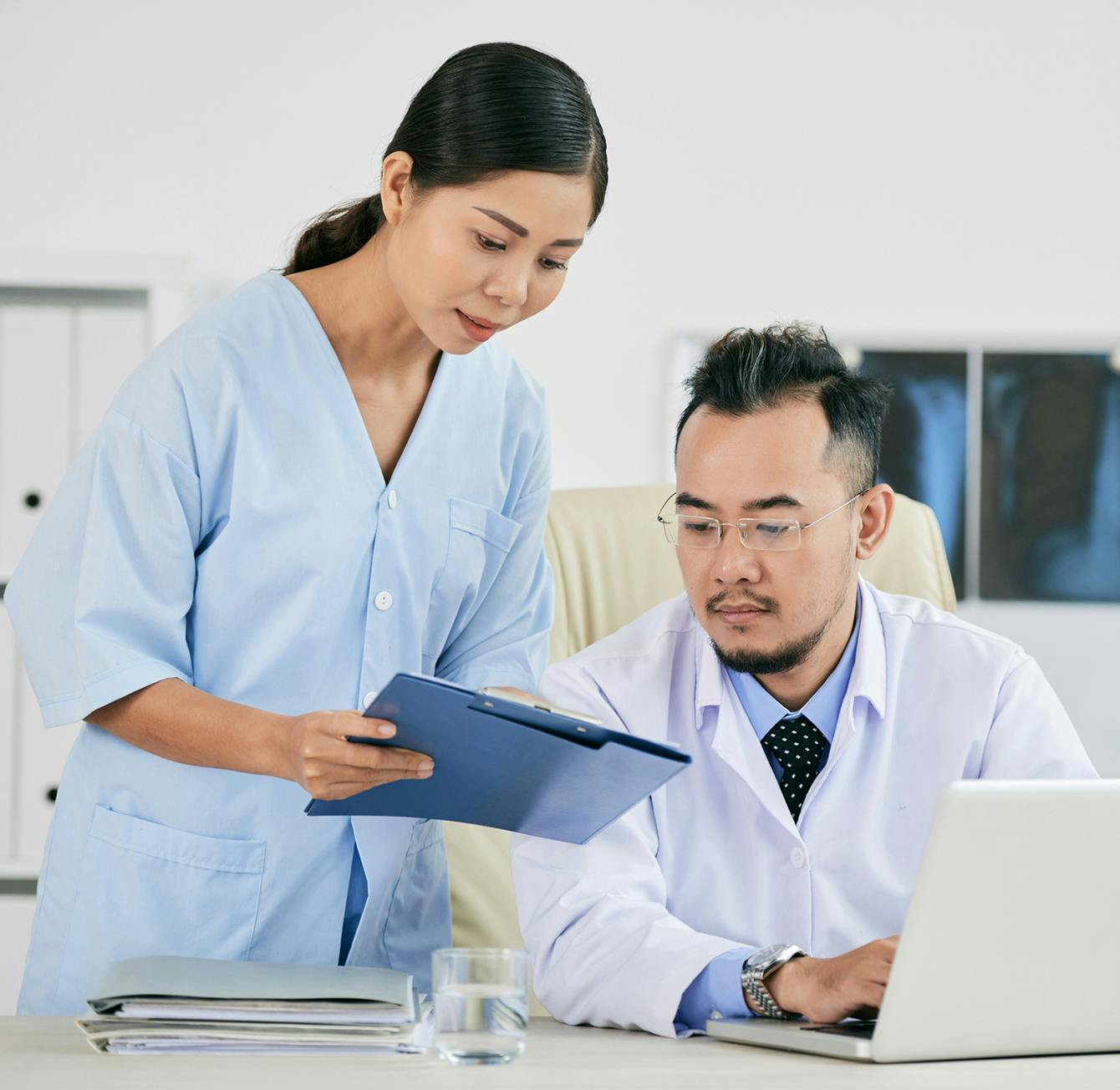 doctors examining records