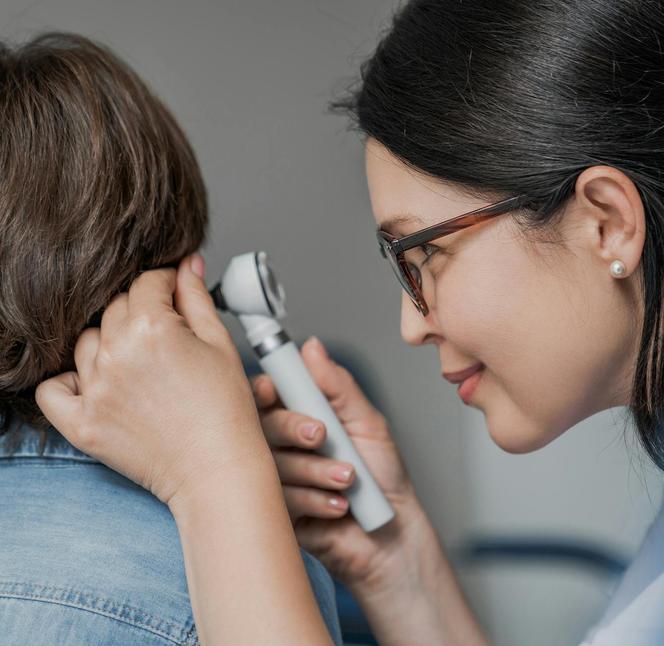 doctor diagnosing ear