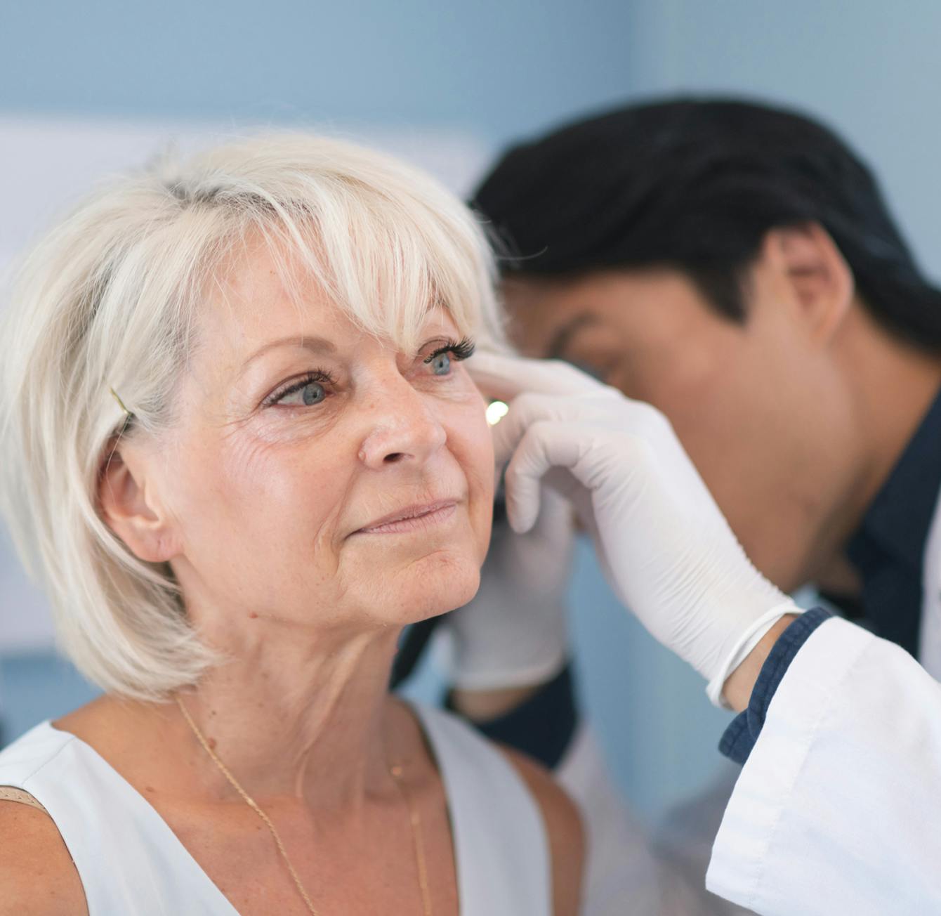 doctor diagnosing ear