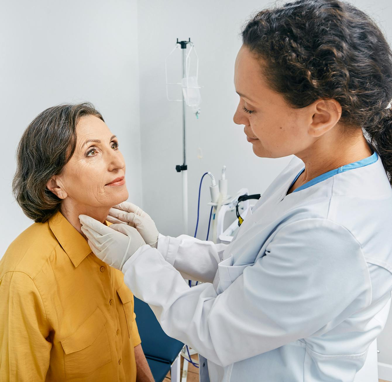 woman having her neck checked
