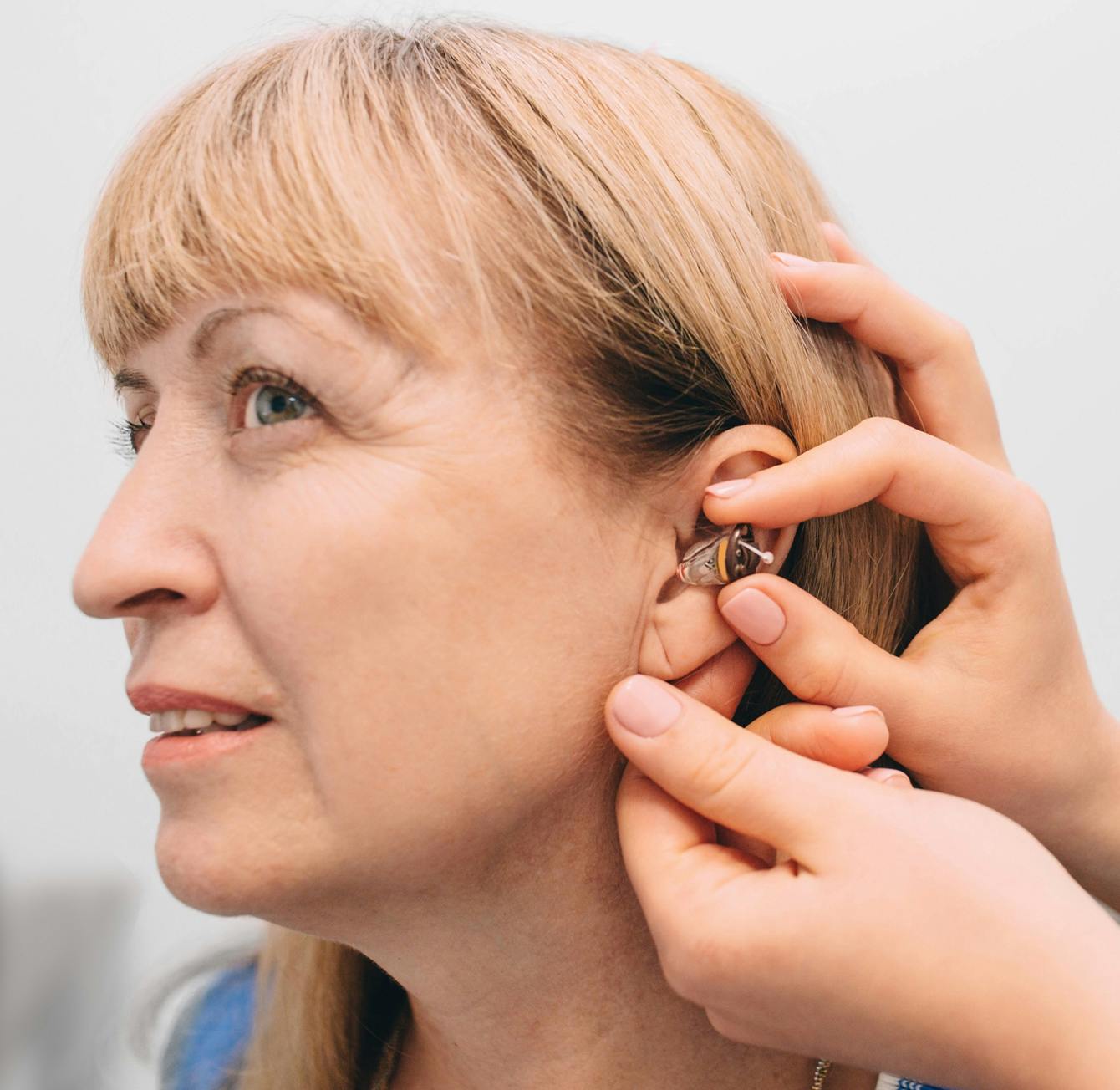 woman getting hearing-aid consultation