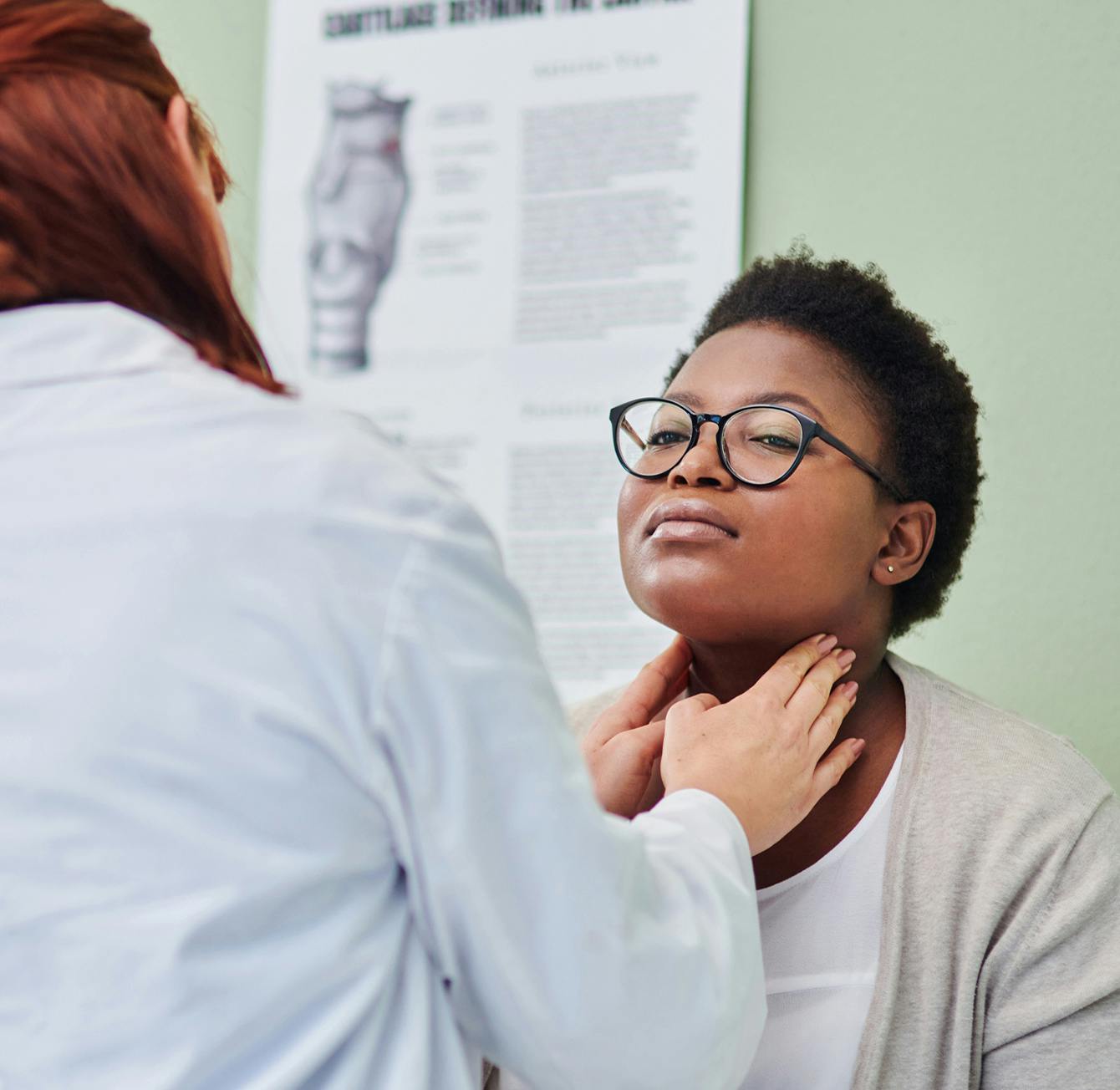 patient having their throat checked by a doctor