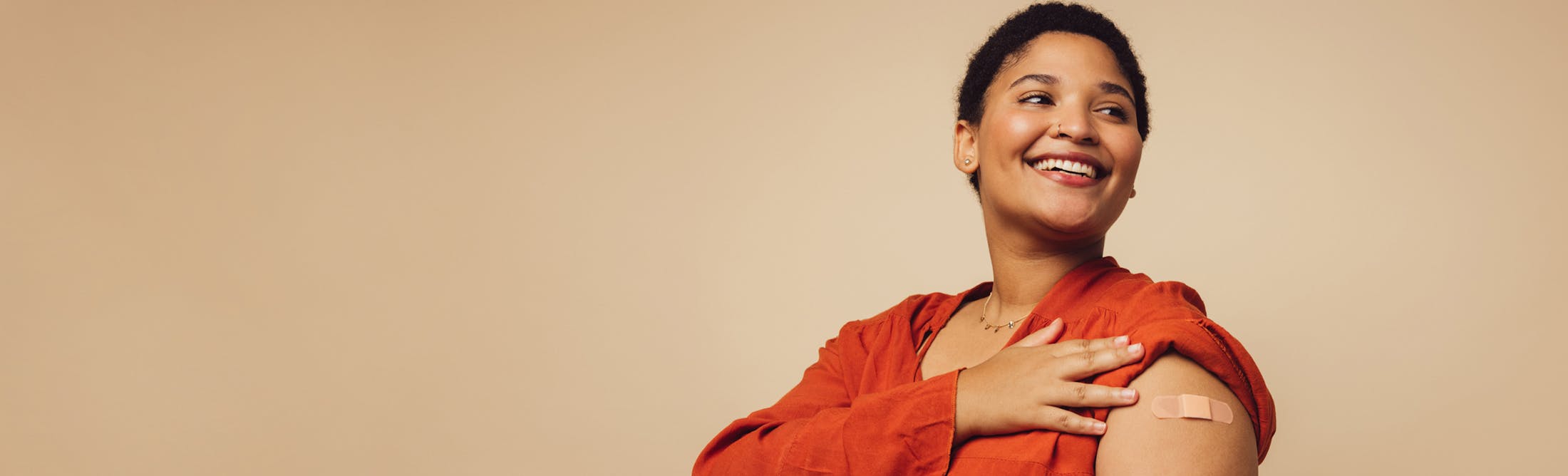 Woman wearing an orange blouse