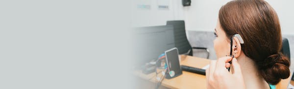 woman having hearing aid consultation