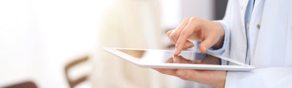 doctor holding an ipad