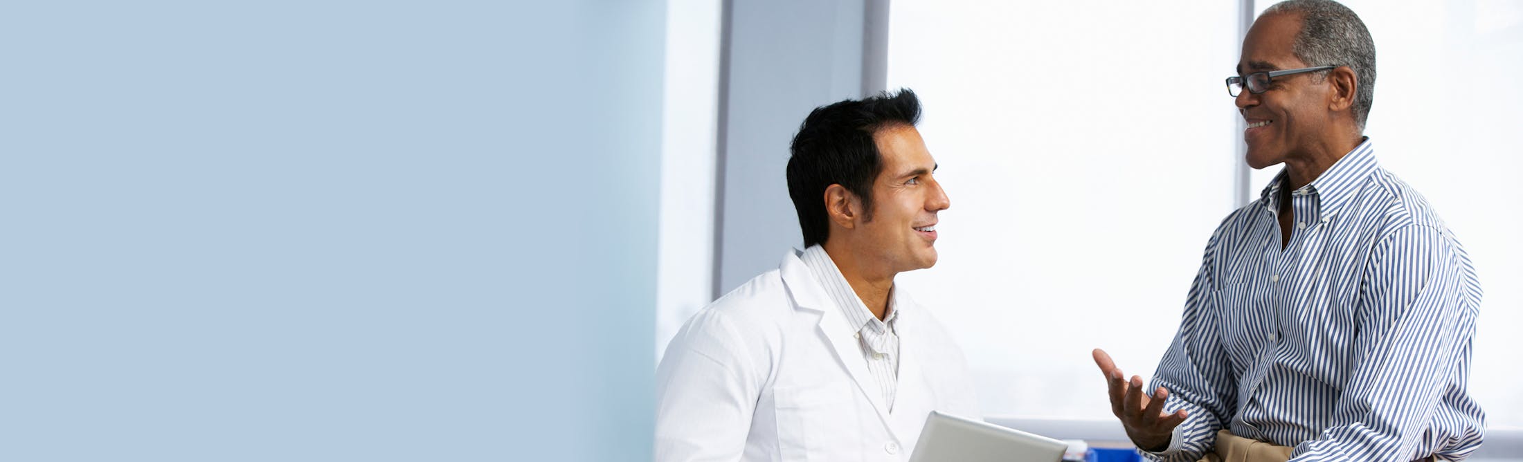 staff at FENTA speaking with a patient