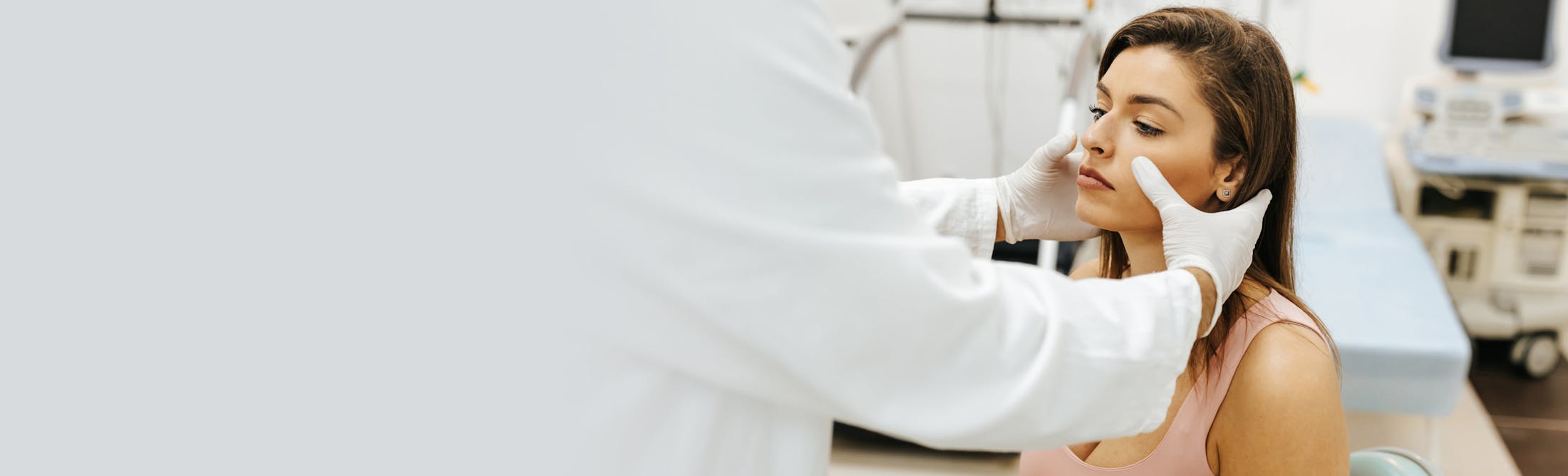 woman having her sinuses checked by a doctor