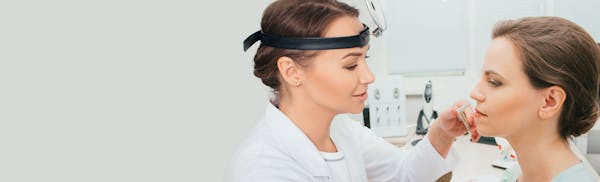 doctor performing nasal procedure