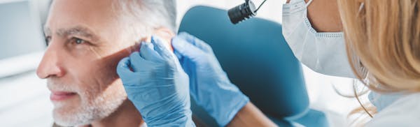 man getting an ear exam