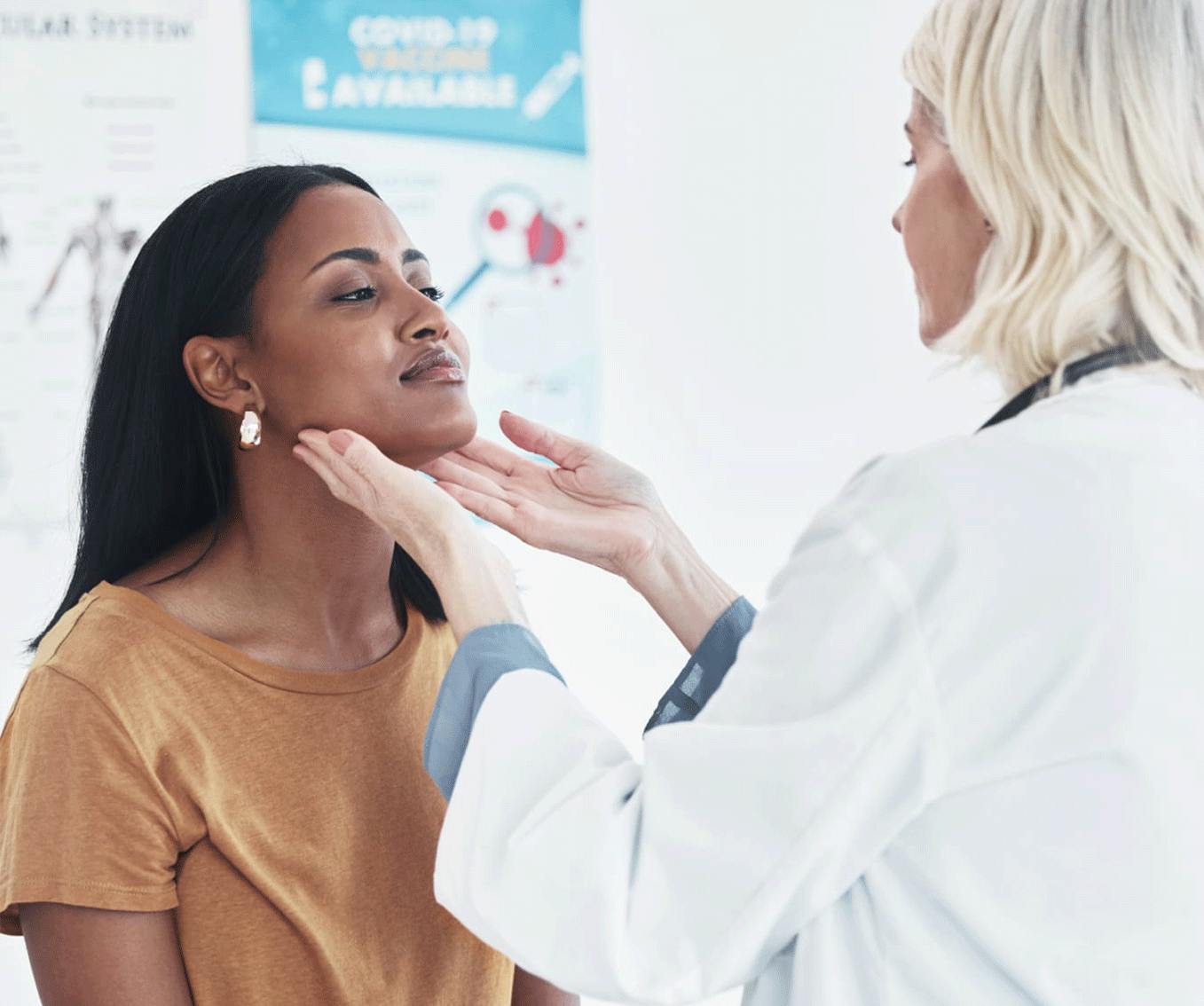 doctor checking a patients throat