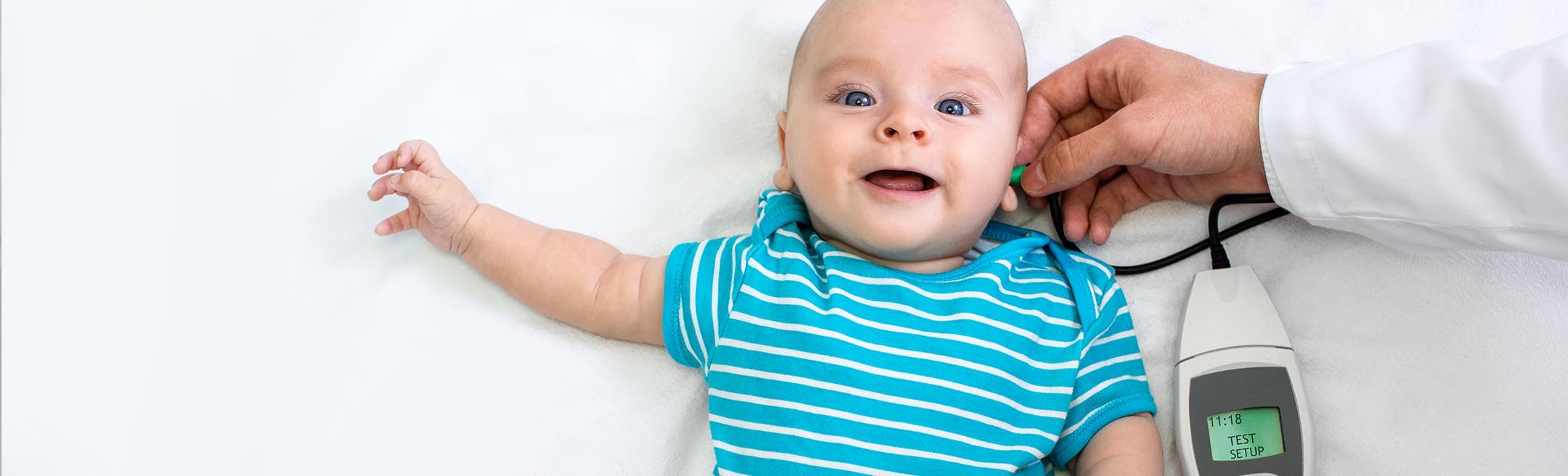 baby wearing a blue and white striped outfit