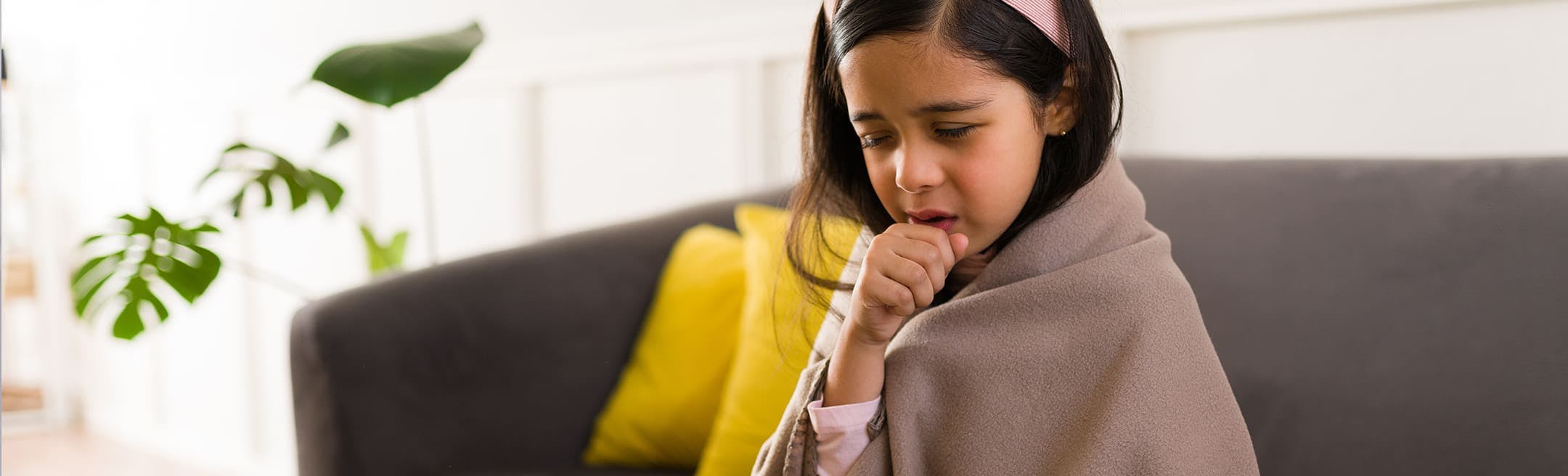 young girl coughing