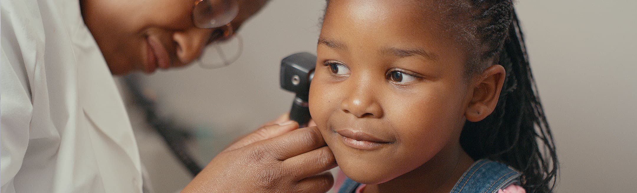 young girl getting an ear exam