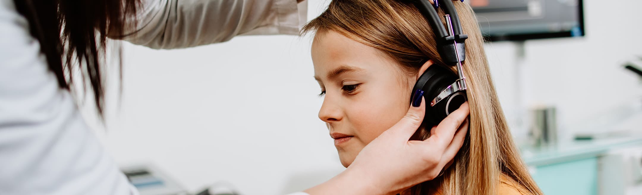 young girl undergoing a hearing test